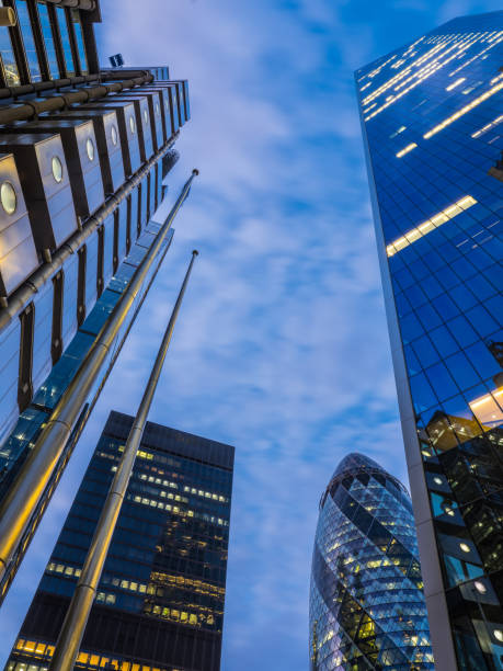 istock Futuristic financial district skyscrapers illuminated dusk soaring into sky London 1920280284