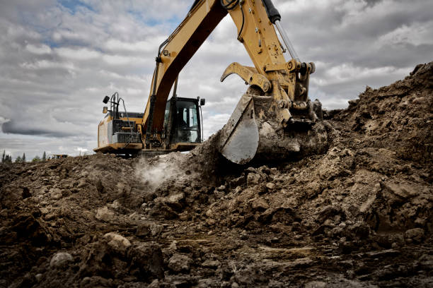 istock Excavator digging into the ground with its large bucket 1920289131
