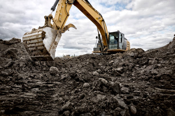 istock a bulldozer is standing on some dirt with the sky behind it 1920289133