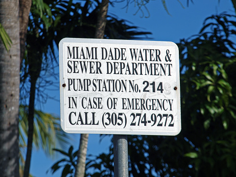 Miami, Florida, United States - January 1, 2024: Miami-Dade Water and Sewer Department sign at a pump station in a residential area.