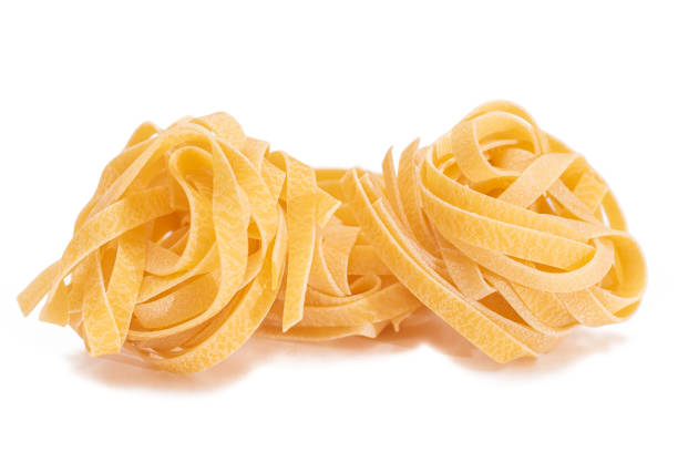 istock Three Classic Italian Raw Egg Fettuccine - Isolated on White Background 1920321817