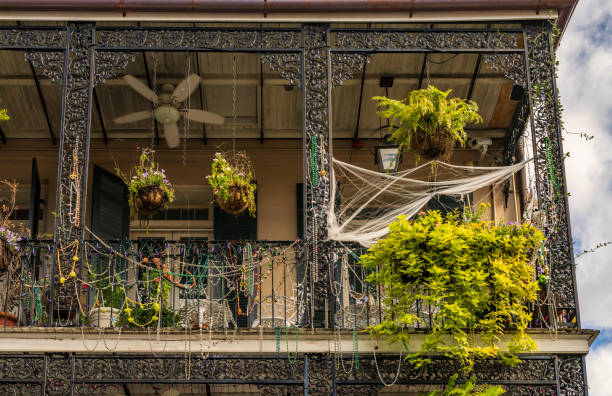 Traditional wrought iron balcony on brick New Orleans house