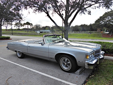 Boca Raton, Palm Beach County, Florida, USA, January  4, 2024. In 1975, the Grand Ville Brougham was available as a 2-and 4-door hardtop and as a convertible. The 1975 model year - the final year for the convertible - saw the most examples produced. The rarest of the Grand Ville convertibles was in 1971, with just under 1,800 examples built.