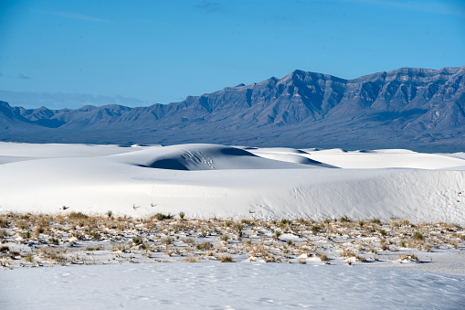 White Sands National Park encompasses 115 square miles of dunes in New Mexico's Tularosa Basin made from gypsum carried on the wind from the San Andres Mountains that borders along the West.