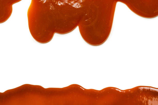 istock Background of flowing caramel sauce isolated on white. 1920355133