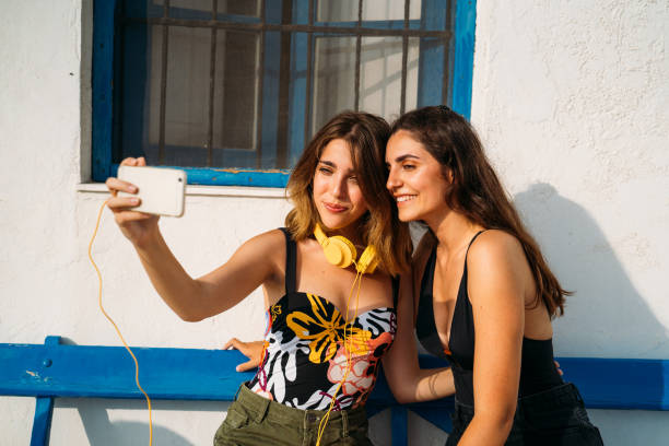 istock Happy girlfriends taking selfie on smartphone 1920361882