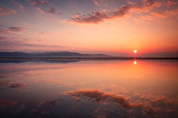 istock Cloud Reflections at Sunrise, Blackrock Beach, Dundalk, Louth, Ireland 1920365509