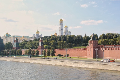 Autumn cold sunset over the city. Moscow downtown. Touristic concept. Kremlin Towers, Red Wall, Ivan the Great Bell Tower, Dormition Cathedral, Grand Kremlin Palace.