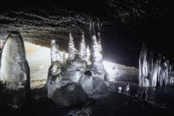 istock Ice stalagmites in a cave underground, icicles, speleology. 1920388496