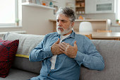 Mature Adult Man Having Heart Attack at Home
