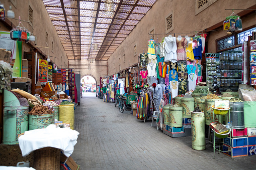 The vibrant souk in Marrakech is a bustling maze of stalls brimming with an array of goods. From richly coloured spices and intricate textiles to traditional crafts and sparkling lanterns, the souk is a tapestry of colours and scents, offering a glimpse into the heart of Moroccan culture and commerce.
