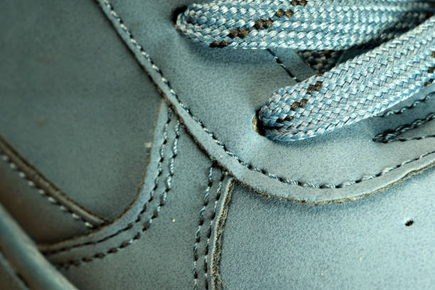 Light blue demi-season leather boots, shoe store banner, leather background, close-up