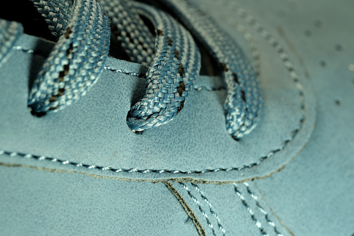 Light blue demi-season leather boots, shoe store banner, leather background, close-up