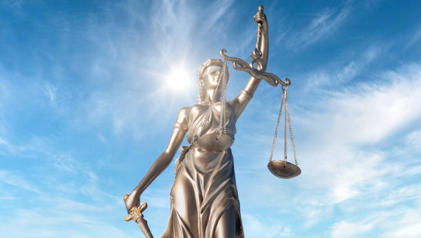 istock Statue of Justice with sunlight 1920426660