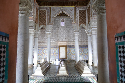 An image capturing the solemn beauty of the Tomb of the Kings in Marrakesh, where the architectural elegance and historical significance of the site are evident. This ancient burial ground, with its ornate design and quiet dignity, stands as a testament to Morocco's rich and storied past.