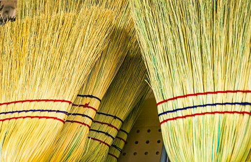 New locally made straw brooms being sold at a farmers market in Lancaster County, Pennsylvania.