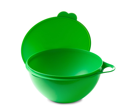 Large green plastic container with a sealed lid with a capacity of four liters, isolated on a white background. Ecoplastic kitchenware for transporting and storing food.