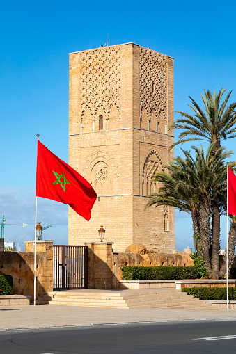 An image showcasing the Mausoleum of Mohammed V and the nearby Unfinished Mosque in Rabat, Morocco. This site combines solemn reverence and historical intrigue, featuring intricate Islamic architecture and a significant legacy in Moroccan history.