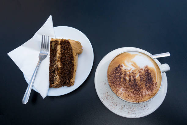 Cup of cappuccino and chocolate cake