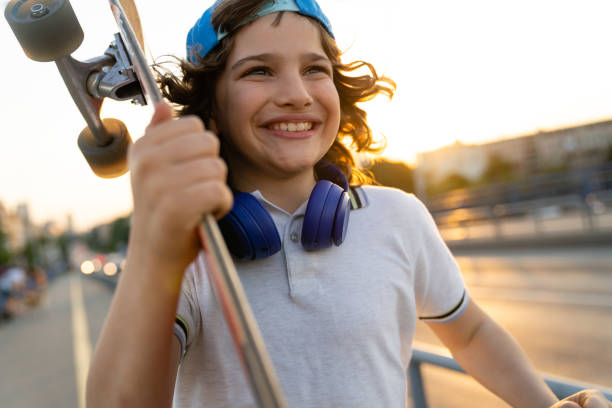 istock Young boy skateboarding on a sunny summer day 1920622073