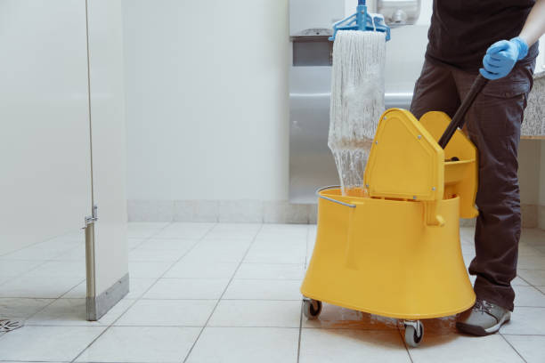 istock unrecognizable woman using a yellow mop bucket 1920703273