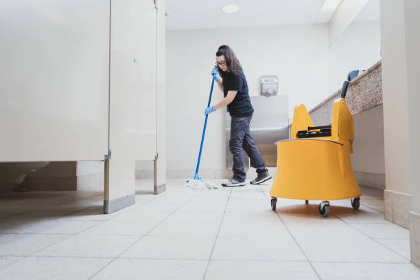 istock cleaning woman mopping a bathroom using a yellow bucket 1920703278