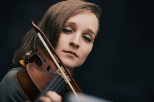 istock Serene musician plays historic Baroque violin soulfully 1920733256