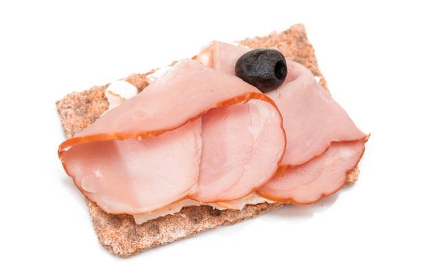 istock Whole Grain Crispbread with Ham, Cream Cheese and Olives - Isolated 1920762479