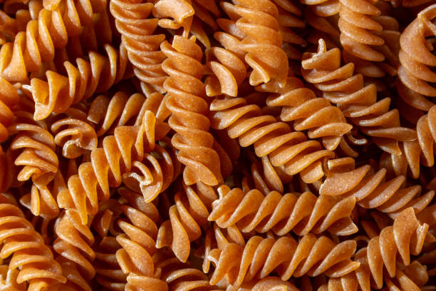 istock Uncooked Whole Grain Fusilli Pasta Background 1920782730