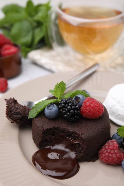 istock Delicious chocolate fondant served with fresh berries on table, closeup. Space for text 1920847534