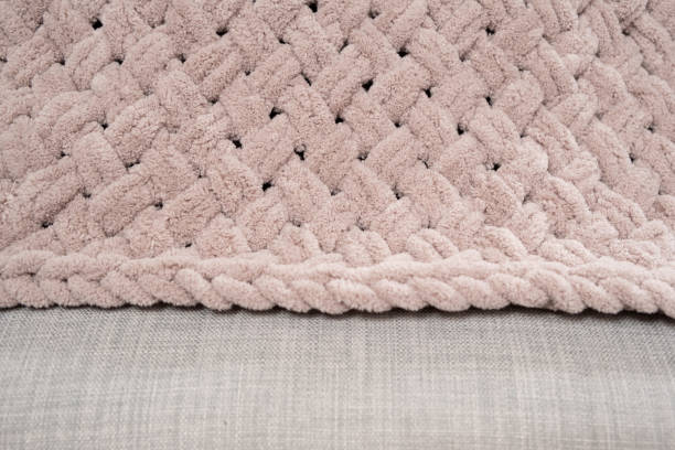 istock Patterns of soft plush knitted blanket handmade, color dusty rose 1920889459