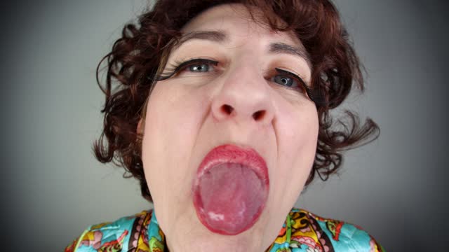 Funny Older Woman Making Face Sticking Tongue Out Teasing