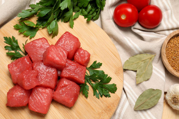 istock Raw beef meat and different ingredients for cooking delicious goulash on table, flat lay 1920902970