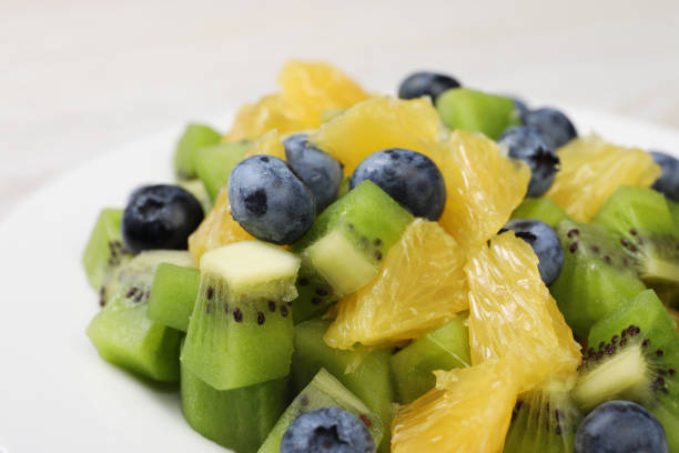 istock Fresh tasty fruit salad on plate, closeup 1920918164