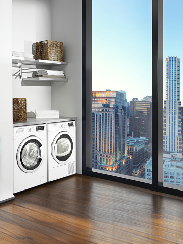 Washer and dryer in a modern building with urban view