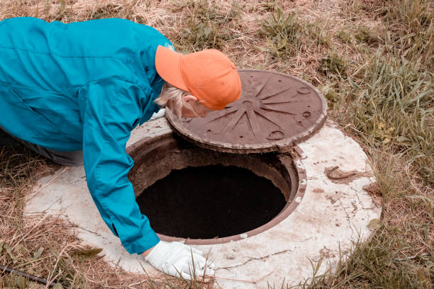 istock The worker leaned over the well. Plumbing work in rural areas 1920939773