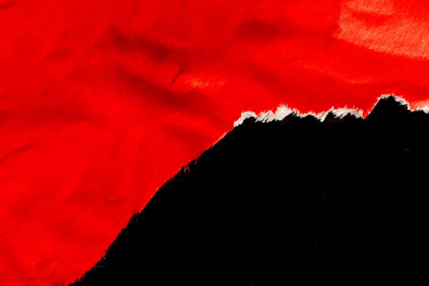 istock Red ripped paper torn edges strips isolated on black background 1920944026