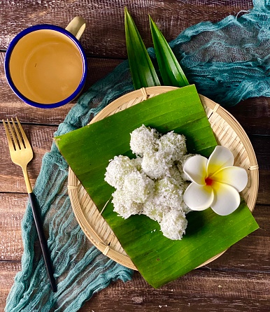 onde-onde or klepon made from glutinous rice flour and filled with brownn sugar covered with grated coconut. also known as kuih buah melaka in Malaysia photo