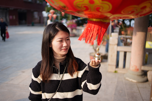 woman holding lantern