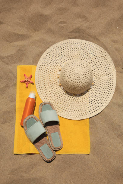istock Sunscreen, starfish and beach accessories on sand, top view. Sun protection care 1920967461