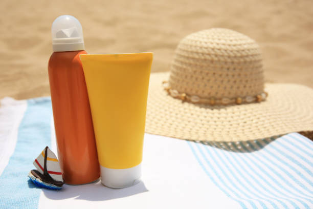 istock Sunscreens and beach accessories on sand, space for text. Sun protection care 1920969180