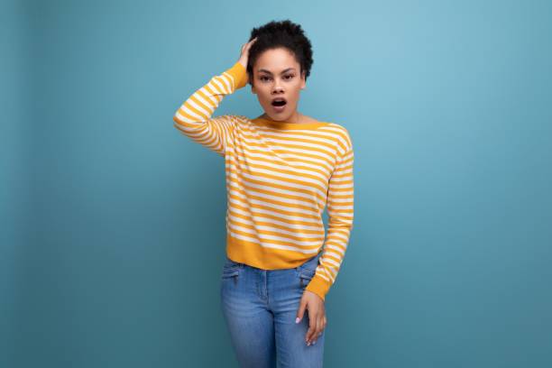 istock models latina young lady with afro curls got insight on studio background 1920980263