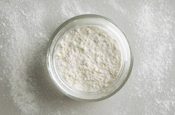 istock Rice loose face powder on light grey background, top view. Makeup product 1920980808