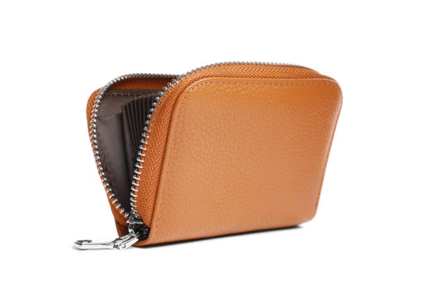 Brown leather wallet full of money.