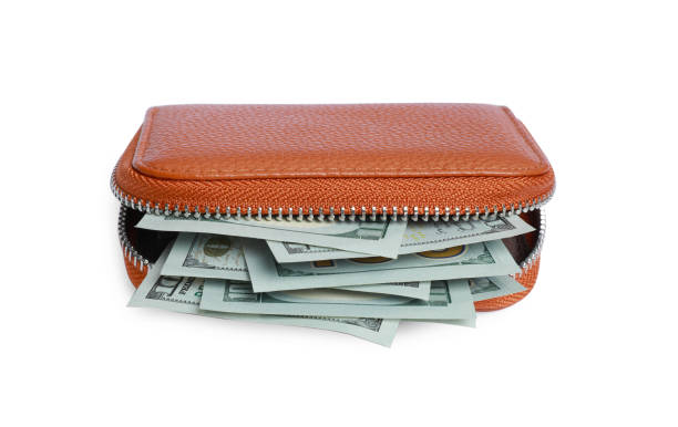 istock Stylish brown leather purse with money isolated on white 1920990246
