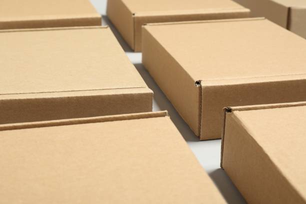 istock Many cardboard boxes on white background, closeup. Packaging goods 1920994910