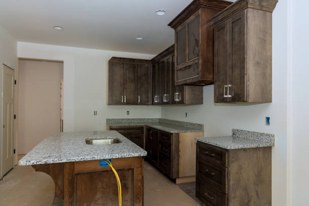 istock New home is currently being constructed with a custom modular kitchen that consists of cabinets with an island in center 1921095083