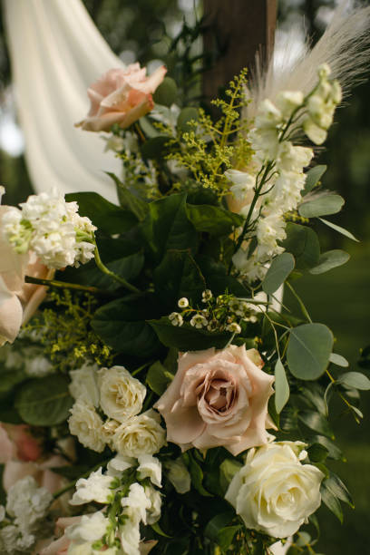 istock Modern ceremony floral arch with roses and eucalyptus leaves 1921097714