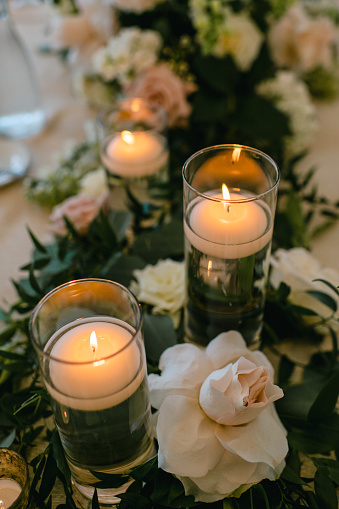 Wedding reception table decor with candles and floral tablescape in Chicago, Illinois, United States