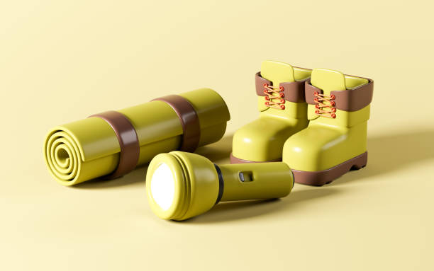 istock Cartoon flashlight, hiking boots and camping carpet, 3d rendering. 1921100342